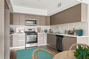 Los Angeles apartment for rent - a modern kitchen with stainless steel appliances and wooden cabinets