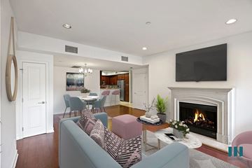 Los Angeles apartment for rent - a living room with a fireplace and a table with chairs