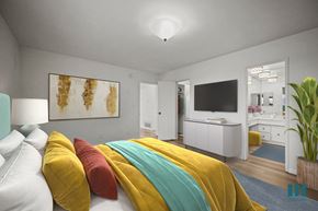 Los Angeles apartment for rent - A bedroom with a bed covered in yellow and red pillows.