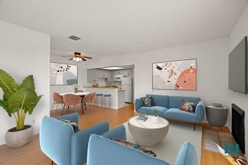 Los Angeles apartment for rent - A living room with blue chairs and a white coffee table.