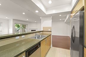Los Angeles apartment for rent - Open-Concept Kitchen and Living Room Area with Electric Fireplace and Patio