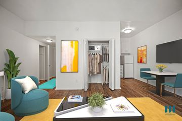 Los Angeles apartment for rent - A modern living room with a blue chair and a coffee table.
