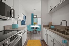 Los Angeles apartment for rent - A kitchen with a table and chairs in the middle.