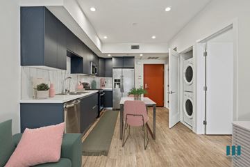 Los Angeles apartment for rent - a kitchen and living room with a washer and dryer and a dining table