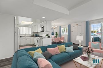 Los Angeles apartment for rent - a living room with a blue couch and a kitchen