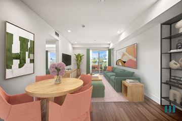 Los Angeles apartment for rent - A modern living room with a wooden table and pink chairs.