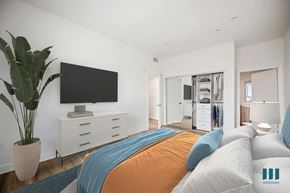 Los Angeles apartment for rent - a bedroom with a large bed and a tv