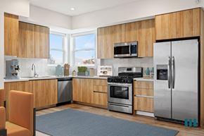 Los Angeles apartment for rent - a kitchen with stainless steel appliances and wooden cabinets