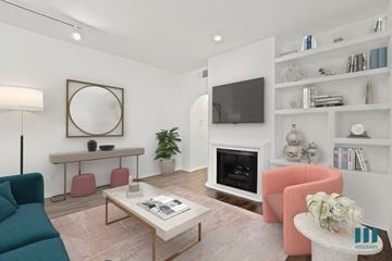 Los Angeles apartment for rent - a living room with a couch and a table and a fireplace