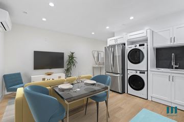 Los Angeles apartment for rent - a living room with a table and chairs and a kitchen with washer and dry
