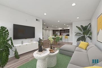 Los Angeles apartment for rent - a living room with a gray couch and a television