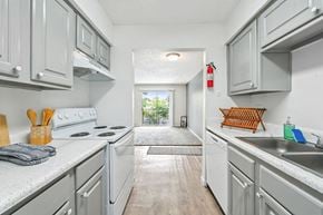 Houston apartment for rent - Bright narrow kitchen with modern finishes at Pine Creek Apartments, Houston, TX 77013