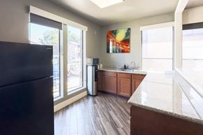 Houston apartment for rent - a kitchen area in the resident clubhouse at Hudson at Westchase Apartments in Houston, Texas