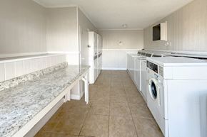 Houston apartment for rent - a large laundry center for residents at Waters at Westchase Apartments