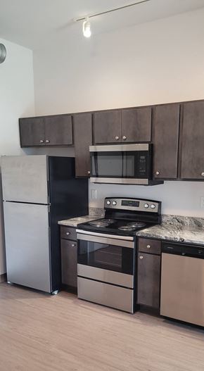 Goshen apartment for rent - a kitchen with stainless steel appliances and a counter top