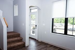 Plymouth apartment for rent - A hallway with a staircase leading to the second floor.