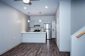 Plymouth apartment for rent - A modern kitchen with a refrigerator, stove, and oven.
