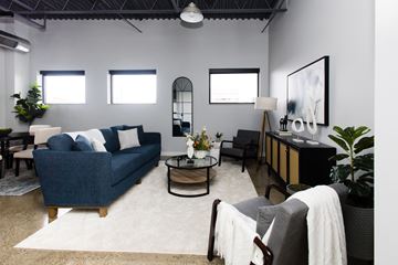 South Bend apartment for rent - a living room with a blue couch and a table
