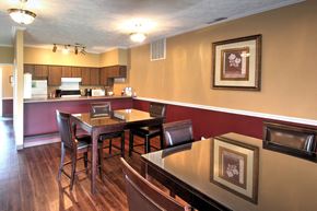 Elkhart apartment for rent - a dining room and kitchen with a table and chairs