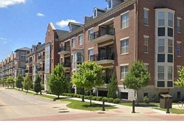 South Bend apartment for rent - a rendering of an apartment building on a street with trees