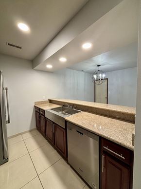 South Bend apartment for rent - A kitchen with a granite counter top and stainless steel appliances.