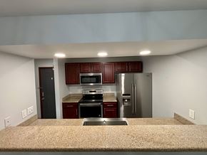 South Bend apartment for rent - A kitchen with a refrigerator, oven, and microwave.