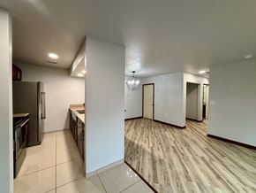 South Bend apartment for rent - A kitchen with white walls and wooden flooring.