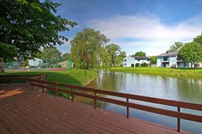 Elkhart apartment for rent - a deck overlooking a lake with houses in the background