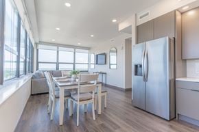 South Bend apartment for rent - A modern kitchen with a dining table and chairs.