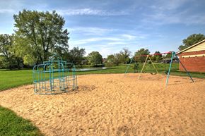 Elkhart apartment for rent - a playground with a swing set in a park