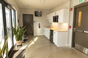 Rooftop outdoor dining area with gas grill