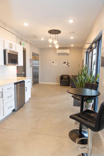 Rooftop outdoor dining area with gas grill