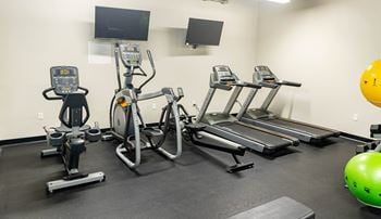 24-Hour fitness center with free weights