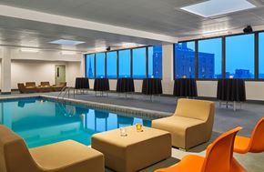 South Bend apartment for rent - A room with a pool, chairs and a table.