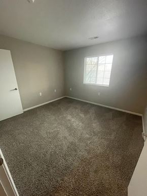 Columbia City apartment for rent - A room with a carpeted floor and a window.