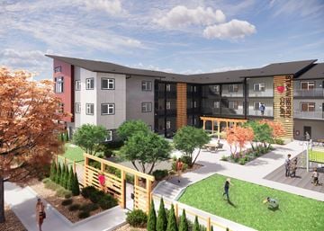 Marysville apartment for rent - A modern apartment complex with a playground and greenery.