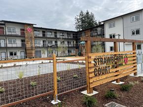 Marysville apartment for rent - A wooden fence with a sign that says Strawberry Court.