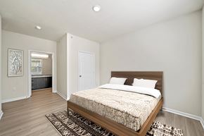 Chester apartment for rent - A bedroom with a large bed and a rug in front of it.