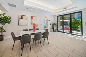 Northridge apartment for rent - A dining room with a white table and chairs.
