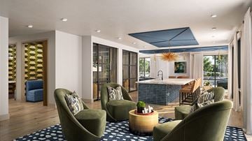 Milford apartment for rent - A living room with a green sofa and a wooden table.