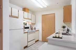 Olympia apartment for rent - Kitchen with fridge at Boardwalk in Olympia WA