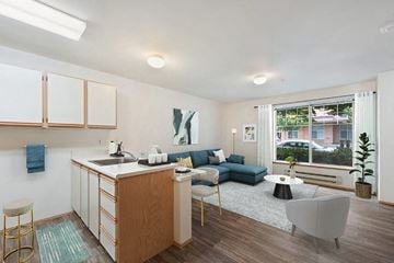 Olympia apartment for rent - a living room with a kitchen and a couch
