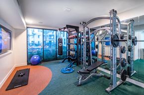 San Diego apartment for rent - Fitness center weight machines at Bevel Apartments in San Diego CA