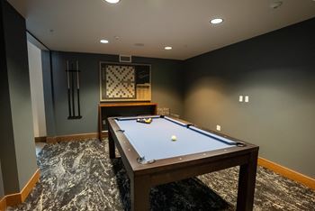 Social lounge with flat screen television, fireplace, kitchen area, and plenty of seating