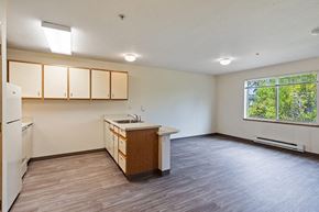 Bellingham apartment for rent - Kitchen and living room at Woodrose Senior Affordable Apartments in Bellingham WA