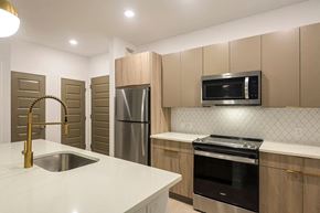 Gaithersburg apartment for rent - Kitchen with light cabinets at 333 Ellington Apartments in Gaithersburg MD