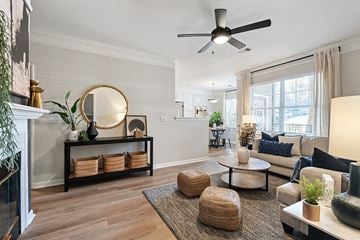 Lawrence apartment for rent - a living room with furniture and a ceiling fan