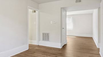 Silver Spring apartment for rent - a living room with a wood floor and an open door