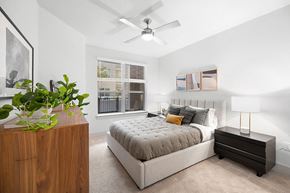 Houston apartment for rent - Model Concrete Design Package Bedroom at East Bend Apartments in Houston TX