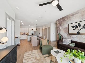 Houston apartment for rent - A modern living room with a brown couch and a large painting on the wall.